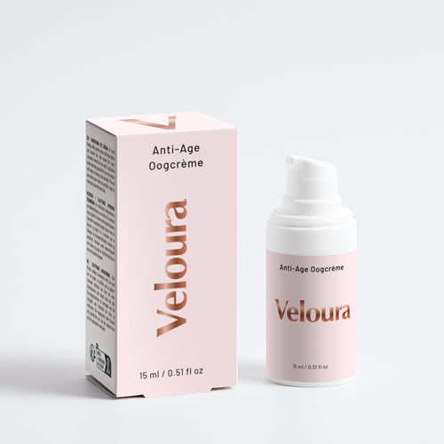 Veloura Anti-Age Oogcrème verpakking en dispenser in zachtroze tint, gericht op natuurlijke huidverzorging en verzorging van de gevoelige huid rond de ogen.